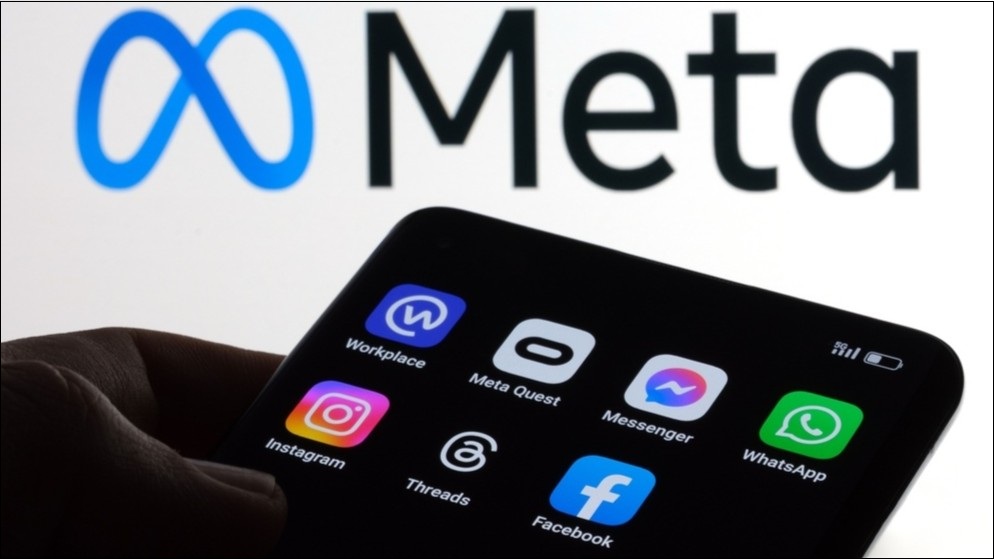 Meta logo, showing Facebook and Instagram app logos on a phone screen.