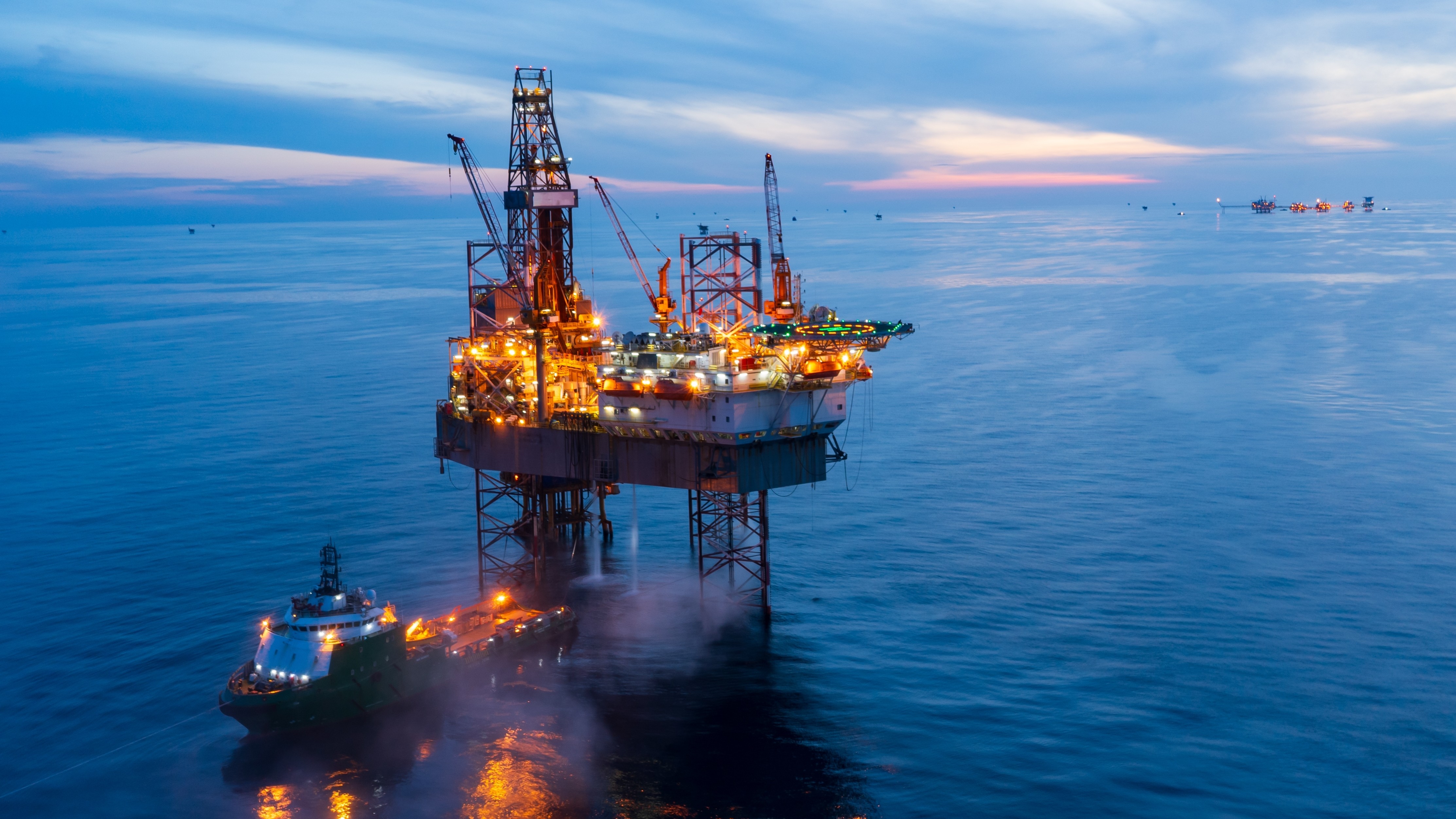 Oil rig in middle of the ocean.