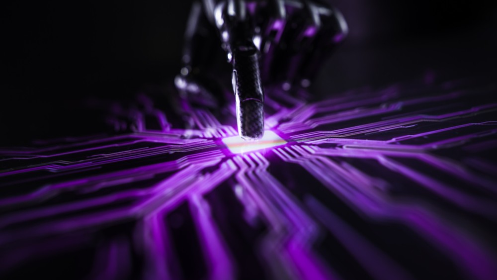 Finger pressing a button with the light below spreading.