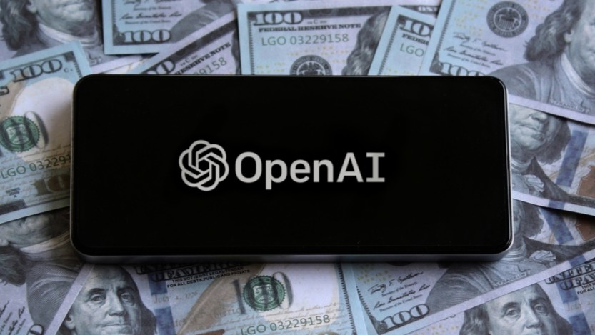 Phone with OpenAI logo on screen, surrounded by US money.