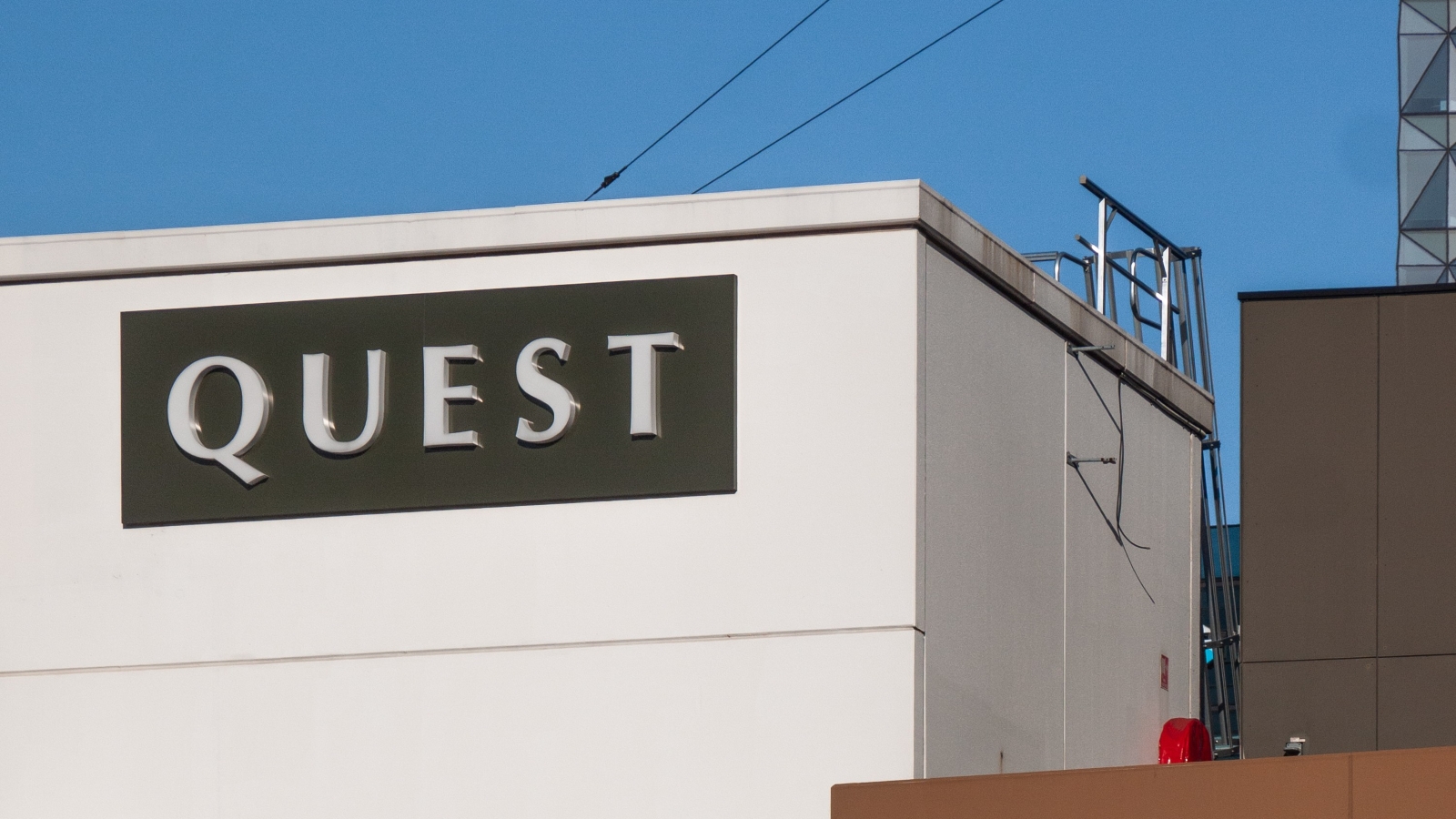 Quest signage on a building.