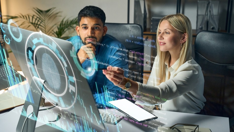 Man and woman looking at a computer screen.
