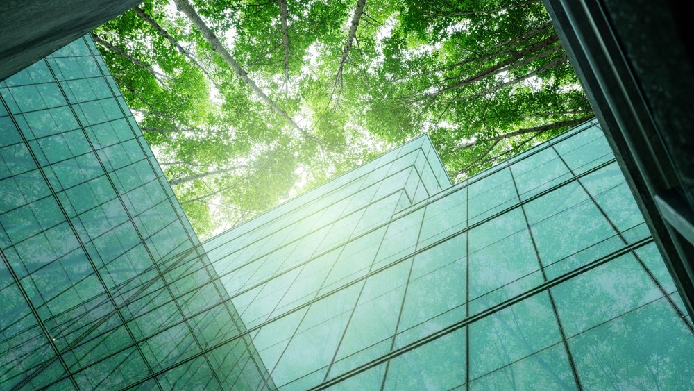 glass data centre and tall trees