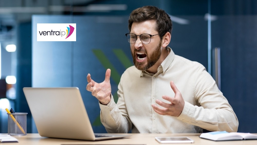 Man screaming at computer