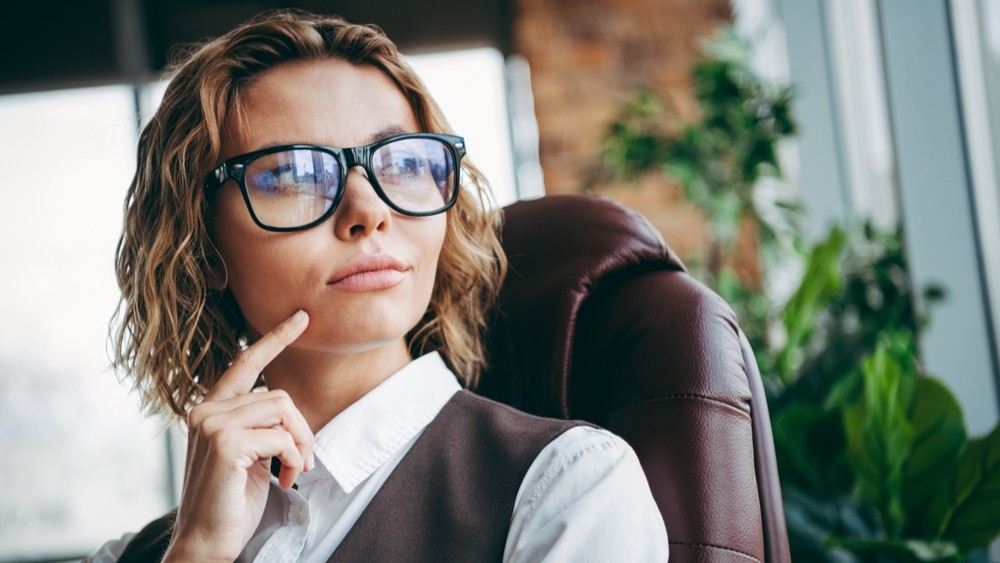 Office worker looking deep in thought.