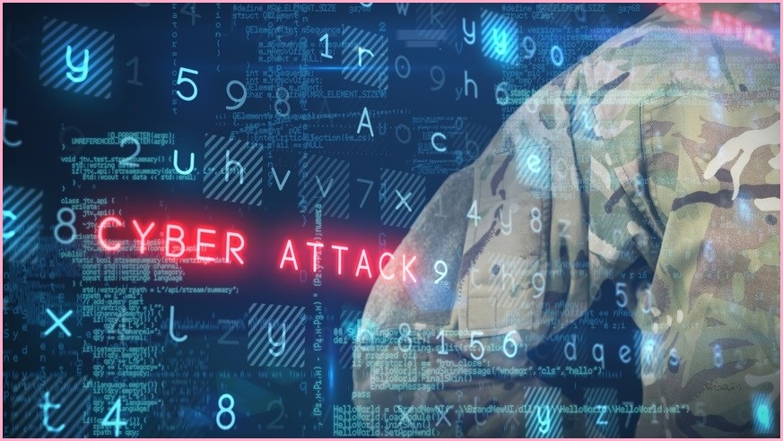 Soldier with 'cyber attack' written across a screen